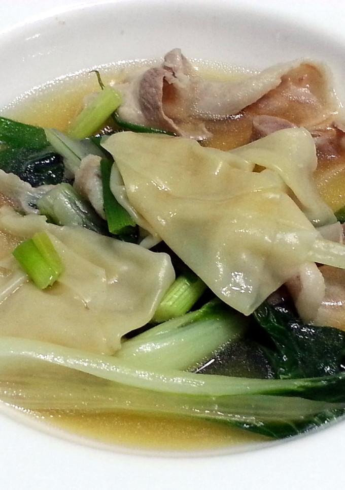 A picture of Bak Choy And Dumpling In Pork Broth.