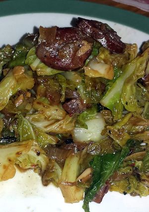 A picture of Fried chorizo and cabbage.