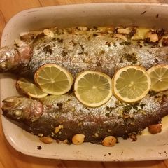 A picture of Baked trout with lemon, herbs and almonds.