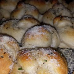 A picture of Parmesan garlic knots.