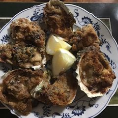 A picture of California Farm Oysters Rockefeller.
