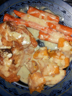 A picture of Roasted Chicken with sweet potato and carrot..
