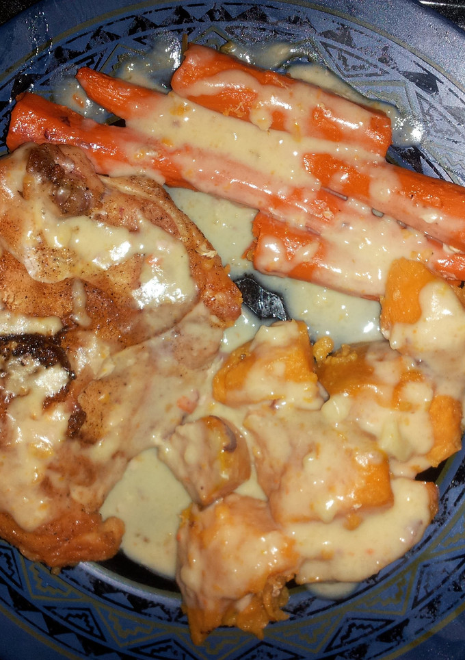 A picture of Roasted Chicken with sweet potato and carrot..
