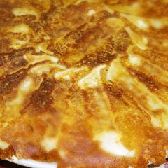 A picture of Crispy Winged Gyoza with Grated Cheese.