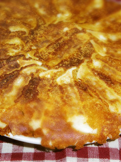 A picture of Crispy Winged Gyoza with Grated Cheese.