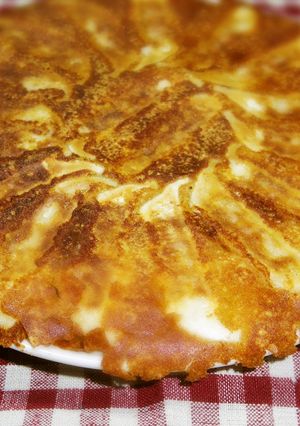 A picture of Crispy Winged Gyoza with Grated Cheese.
