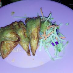 A picture of Fried Pork Wontons and Green Salsa.