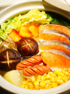 A picture of Salt and Butter Hot Pot with Salmon and Vegetables.