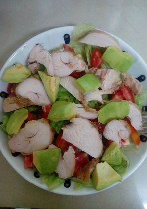 A picture of Grilled Chicken on a bed of lettuce.