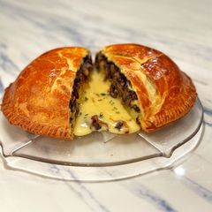A picture of French onion brie mushroom pie.