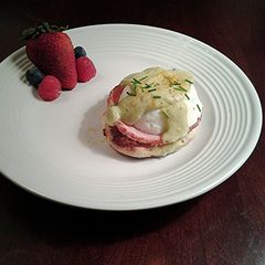 A picture of Eggs Benedict with Avacado Hollandaise Sauce.