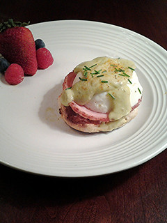 A picture of Eggs Benedict with Avacado Hollandaise Sauce.