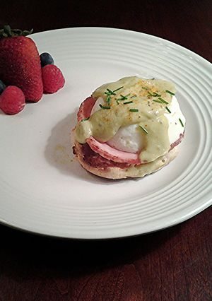 A picture of Eggs Benedict with Avacado Hollandaise Sauce.