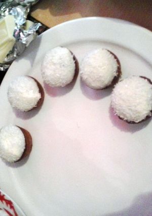 A picture of mini chocolate cupcakes with coconut rasp..