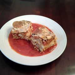 A picture of Lasagna with Sausage and Meatballs.