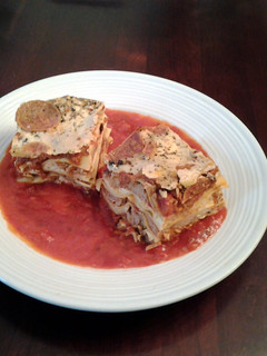 A picture of Lasagna with Sausage and Meatballs.