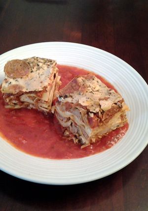 A picture of Lasagna with Sausage and Meatballs.
