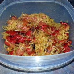 A picture of Roasted red pepper and tomato with spaghetti squash and fresh herbs.