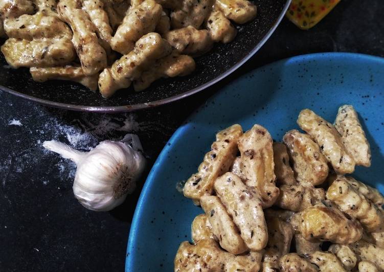 Italian potato gnocchi in cream herb sauce