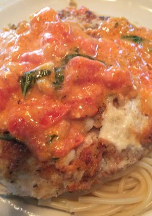 A picture of Farewell Parmesan Crusted Chicken w/light Basil, Tomato, Scampi Cream Sauce.