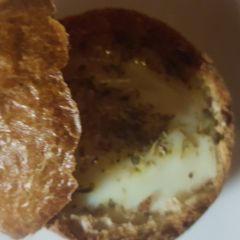 A picture of Egg in a dinner roll.
