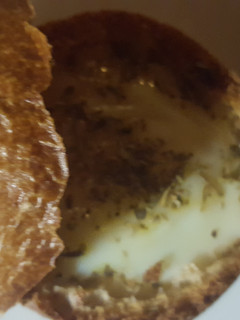 A picture of Egg in a dinner roll.