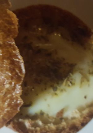 A picture of Egg in a dinner roll.