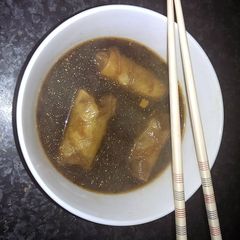 A picture of Sophie's lime chili beef spring roll dumpling soup.