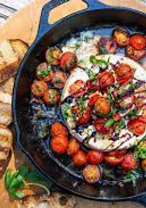 A picture of Caprese Baked Brie.