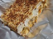 Una foto de lasagna de gambas