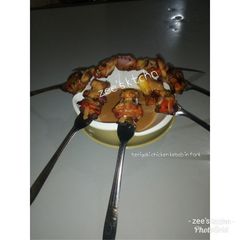A picture of Teriyaki chicken kebab in fork.