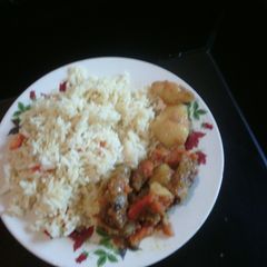 A picture of Chicken stew with rice.