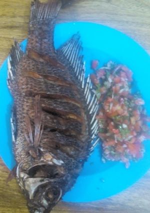 A picture of Fried fish with kachumbari.