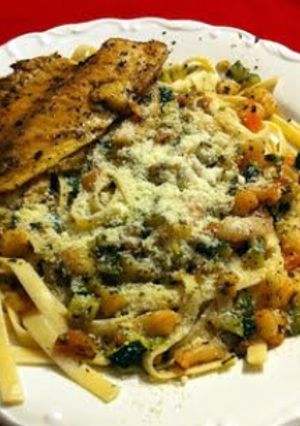 A picture of Shrimp zucchini pasta and tilapia.