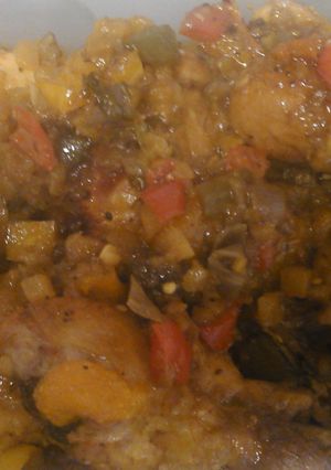 A picture of Tasty Island Chicken with fried cabbage, cornbread and rice.