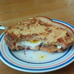 A picture of Grilled Cheese with Fried Egg and Salsa.