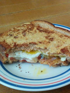 A picture of Grilled Cheese with Fried Egg and Salsa.