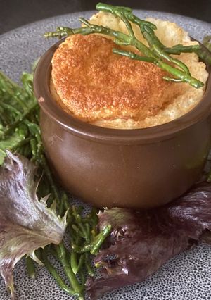 A picture of Cornish Crab Soufflé with Samphire Salad.