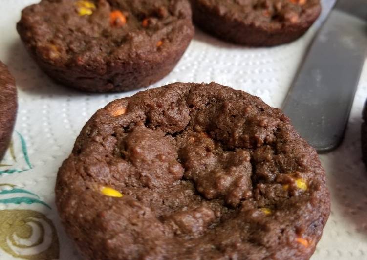 Chocolate Reeses pieces cookies in muffin tins