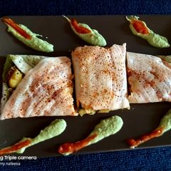 A picture of Schezwan chutney dosa.