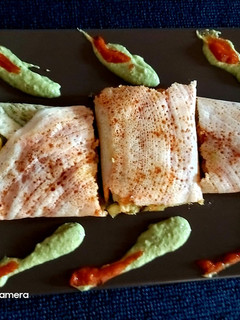 A picture of Schezwan chutney dosa.