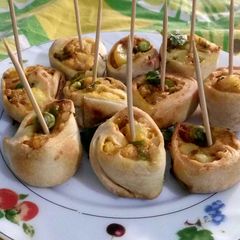 A picture of Baked spiced potato Pinwheel samosa.
