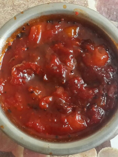 A picture of Tomato chutney with dates and aam papad (mango bars).