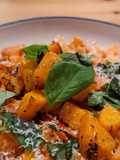 Mafaldine pasta with butternut squash, peppers, and bacon