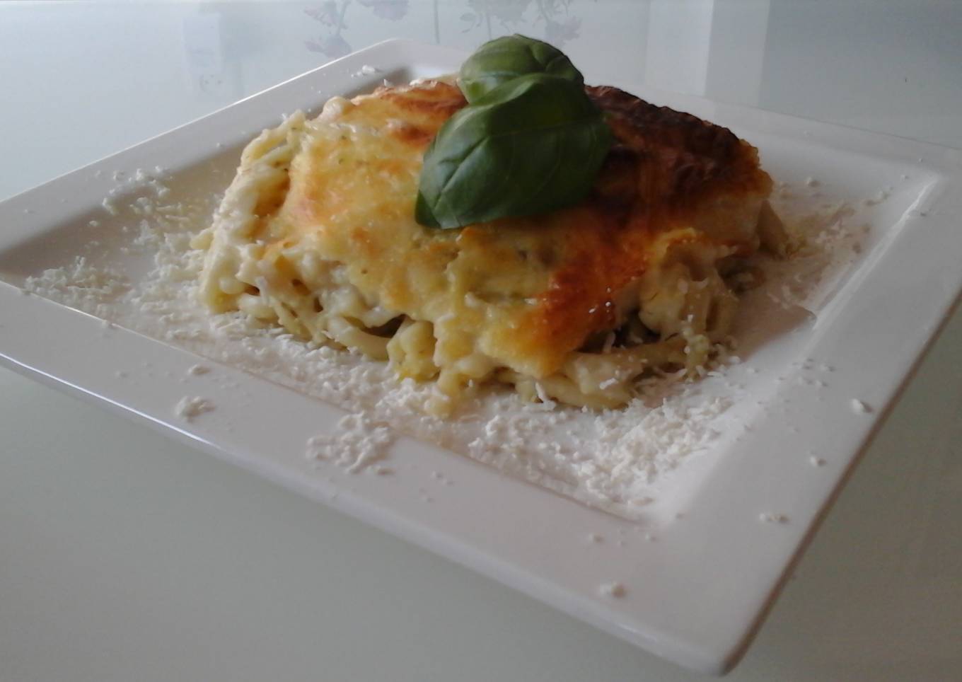 Baked lasagna with zucchini and whipped cheese
