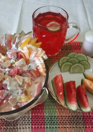 A picture of Fresh fruits salad with yummy fresh cream.