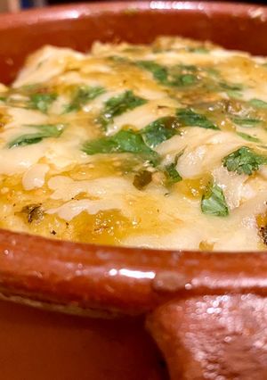A picture of Chicken Enchiladas with Green Sauce.