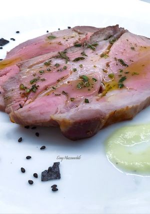 A picture of Fresh Pork Collar with Rosemary Oil and Leek Cream.