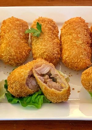 A picture of Taro croquettes with char siu pork stuffing.