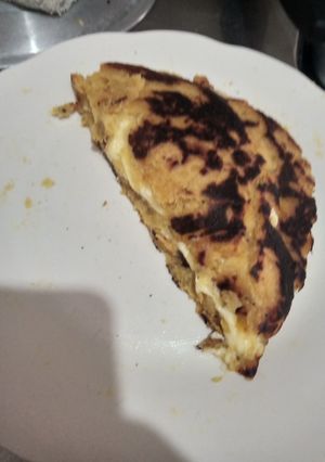 Una foto de Arepa de plátano rellena de quesos
